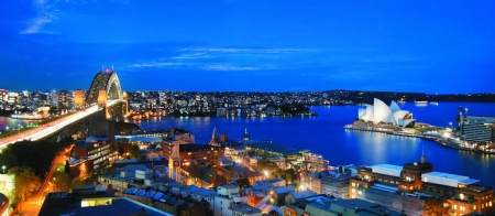 a large body of water with a city in the background