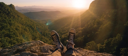 a man standing on top of a mountain