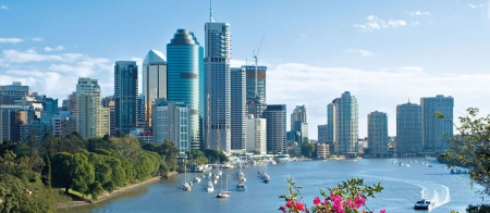 a body of water with a city in the background