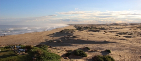 a group of people in a desert area