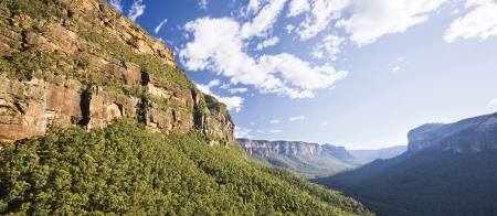 a canyon with a mountain in the background