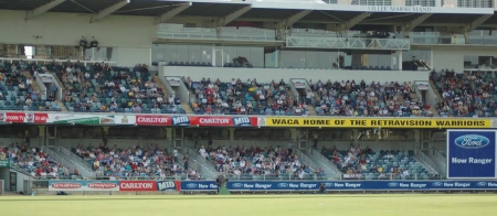 a crowd of people watching a baseball game