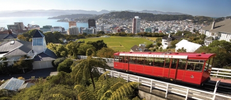 a passenger bus that is parked on the side of Wellington Cable Car