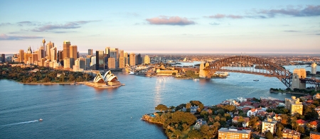 a body of water with a city in the background