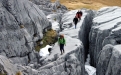 a person standing on a rocky hill