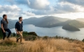 a man standing in front of a mountain